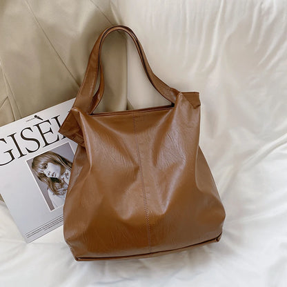 Skórzana torba shopper z regulowanym paskiem