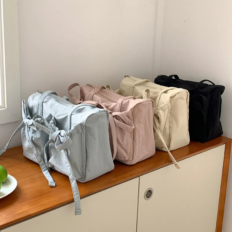Nylonowa torebka na ramię z kokardkami